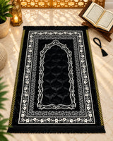 Shab-e-Noor premium black Janamaz with white floral borders, ornate Mehrab design, golden side accents, and black fringes by House of Wriya.