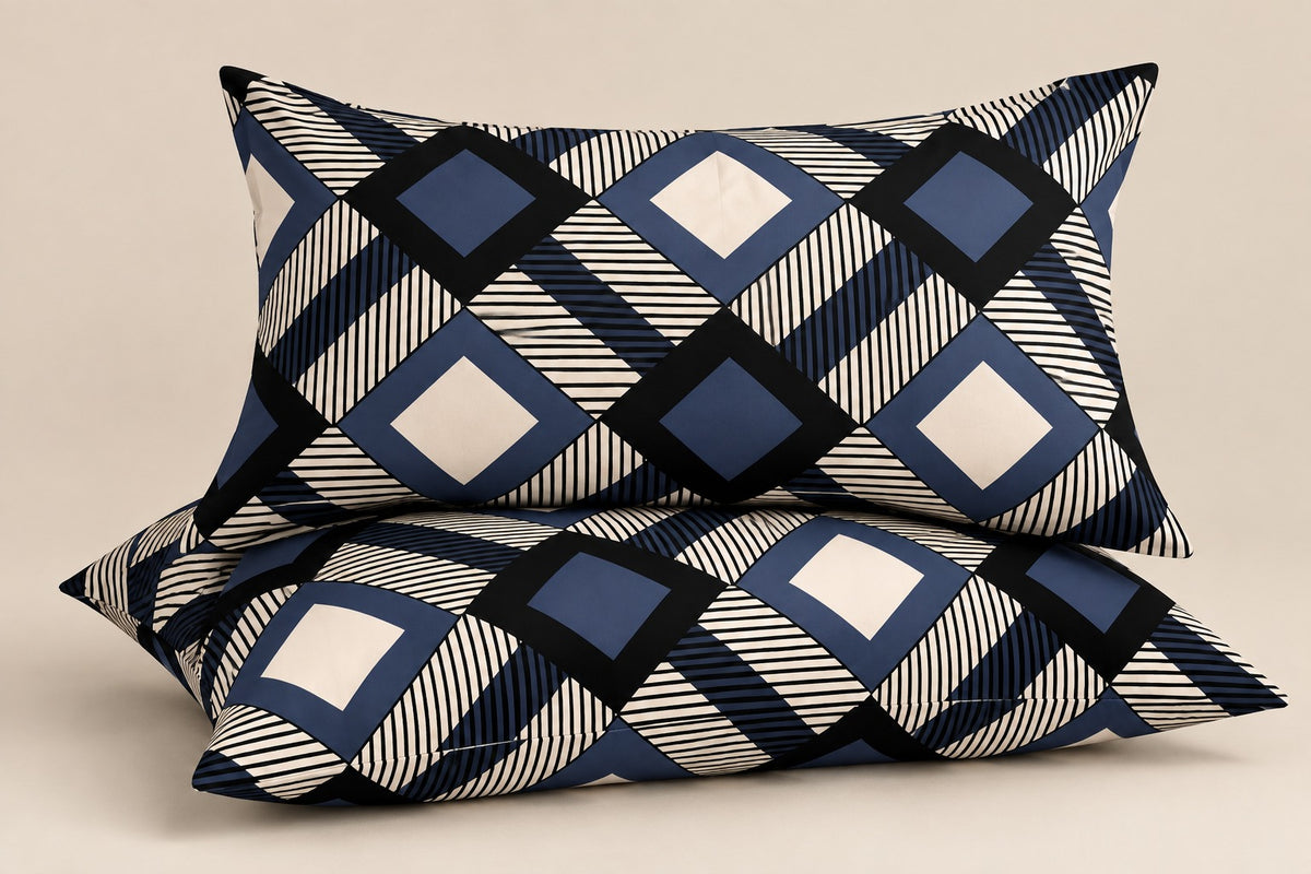 Navy blue geometric pillow covers set of 2 with modern diamond and striped pattern styled on a luxury bedroom