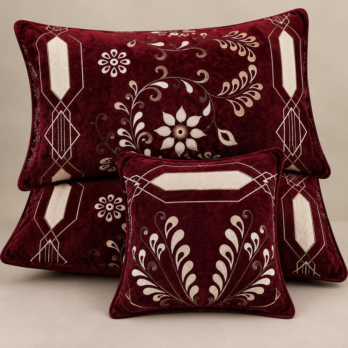 Burgundy velvet cushion covers set with elegant floral botanical design styled for a luxury bedroom