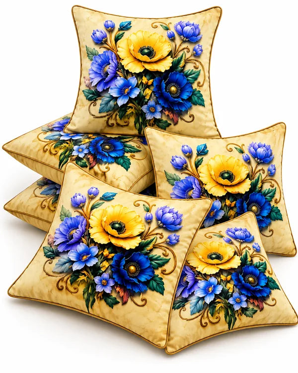 Cream cushion covers featuring vibrant yellow flowers, blue and violet blossoms, green leaves and decorative golden-brown detailing.
