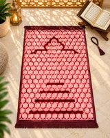 Gul-e-Gulabi premium pink Janamaz with burgundy geometric honeycomb pattern, Mehrab-inspired design, and matching fringes by House of Wriya.