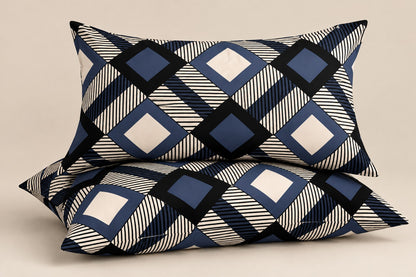 Navy blue geometric pillow covers set of 2 with modern diamond and striped pattern styled on a luxury bedroom