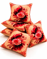 Peach cushion covers featuring large red and black rose designs with decorative red ornamental borders.