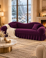 Purple Turkish sofa cover with quilted texture and pleated skirt styled in a luxurious living room.