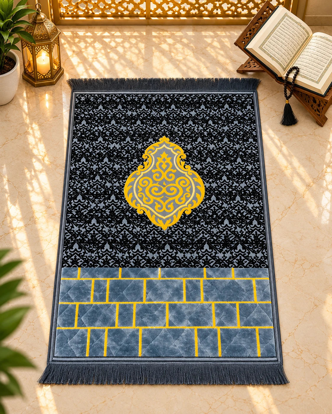 Shahkaar-e-Siyah premium black and charcoal-grey Janamaz with golden ornamental medallion, geometric detailing, and matching grey fringes by House of Wriya.