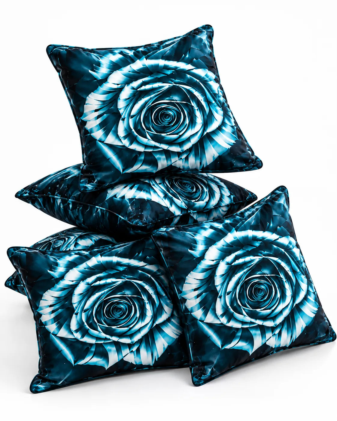 Turquoise blue rose cushion covers with black and white floral detailing arranged on a white background.